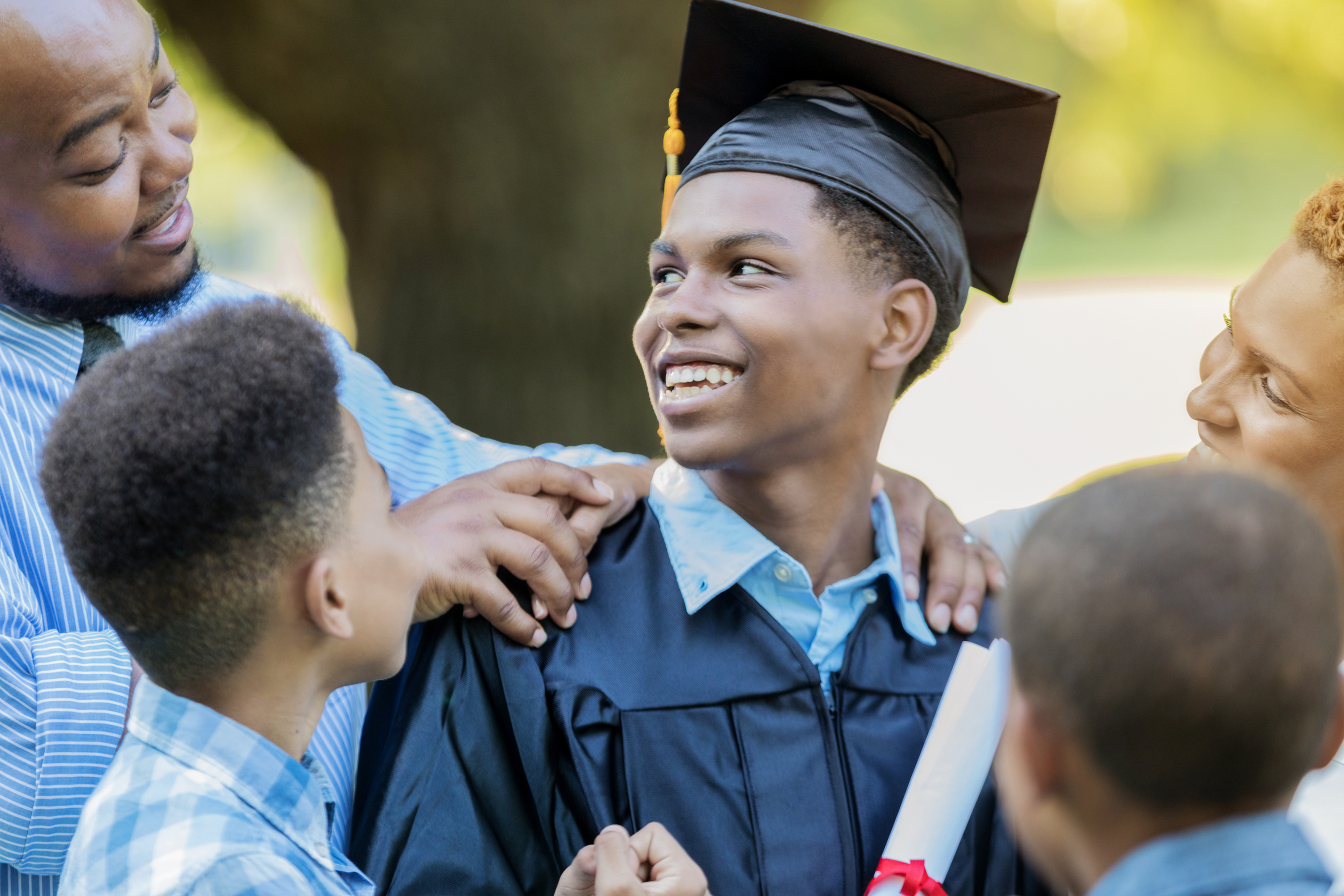 Family congratulates high school graduate
